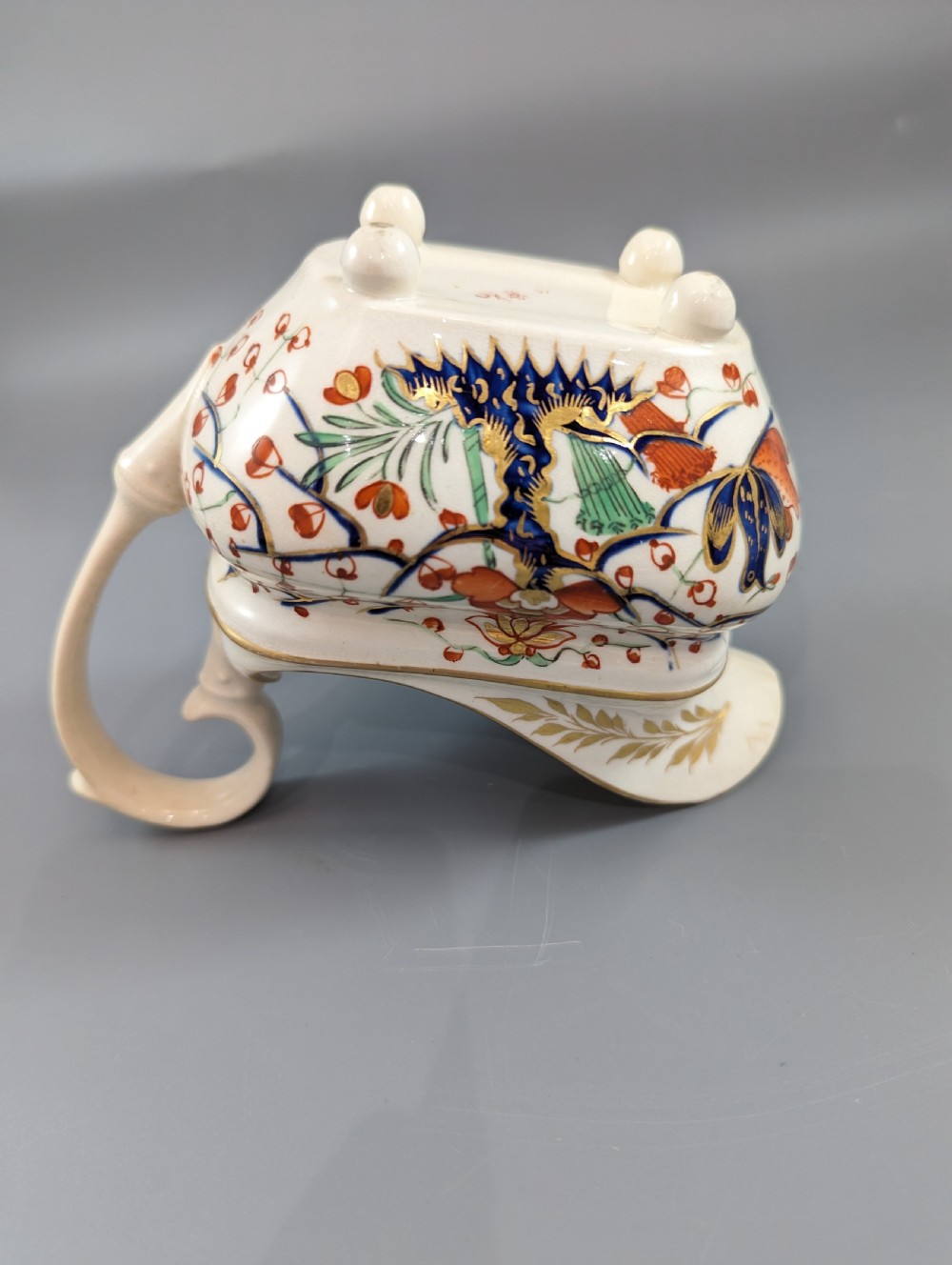 An antique cream-coloured porcelain jug featuring a hand-painted Two Quails design with gilded rim detailing and a raised loop handle. View XIII