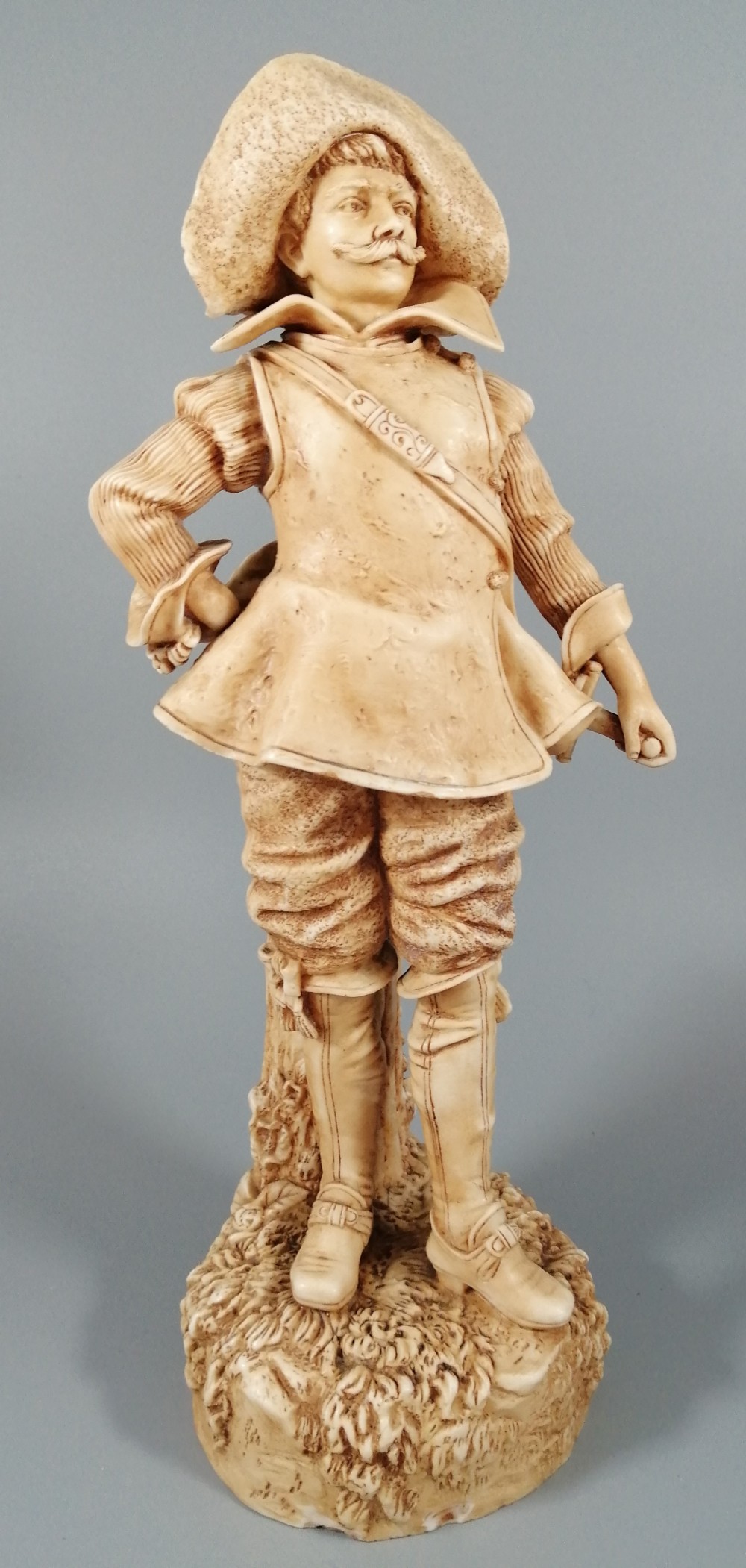 A Robinson and Leadbeater ivory parian ware figure of a musketeer