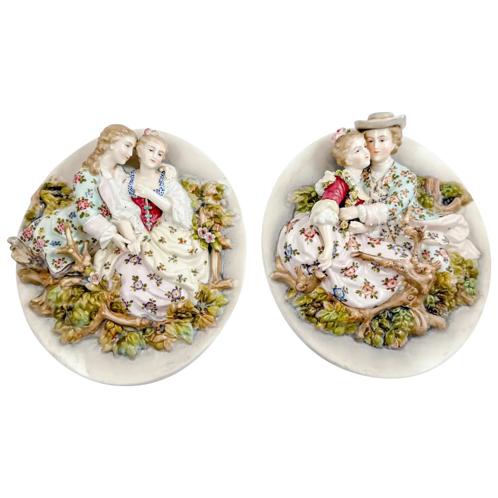 Antique pair early 19th Century porcelain Meissen style continental wall plaques, romantic scenes with lovers