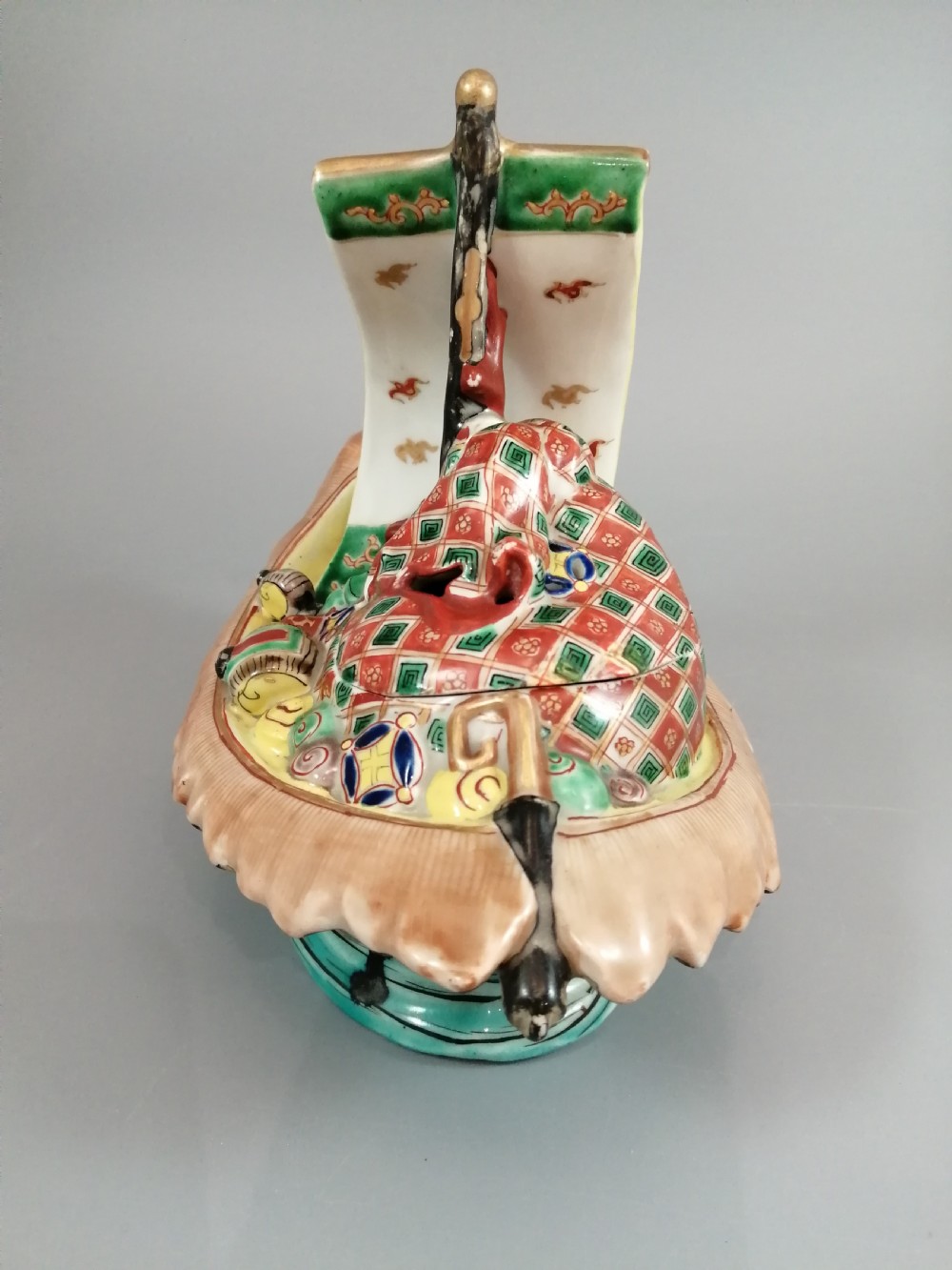 A Japanese Kutani porcelain censer shaped like a Takarabune treasure ship decorated with polychrome enamels and a wave-moulded base. View VI