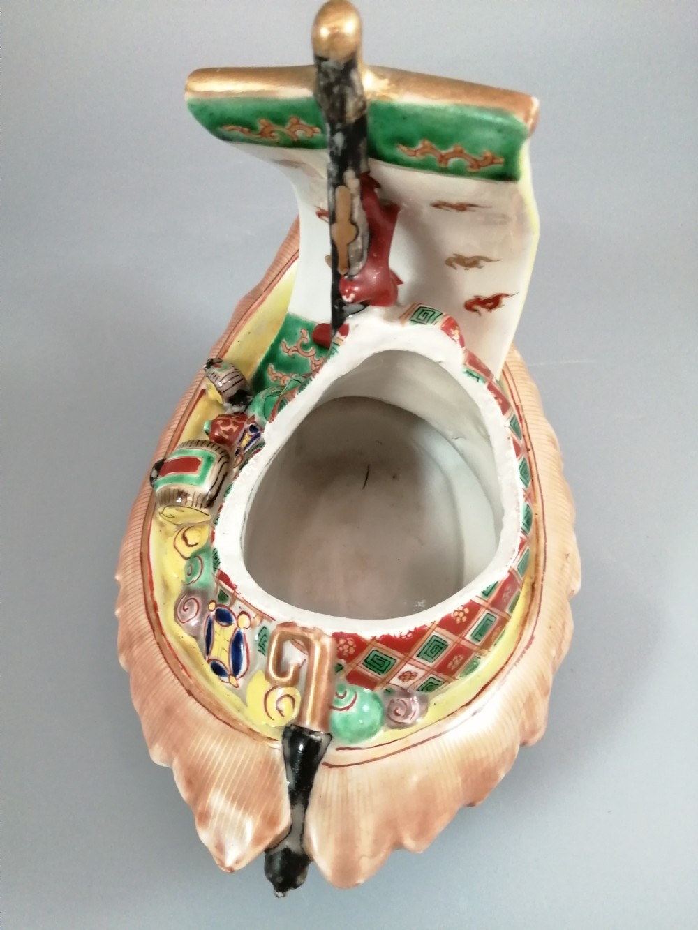 A Japanese Kutani porcelain censer shaped like a Takarabune treasure ship decorated with polychrome enamels and a wave-moulded base. View XIII