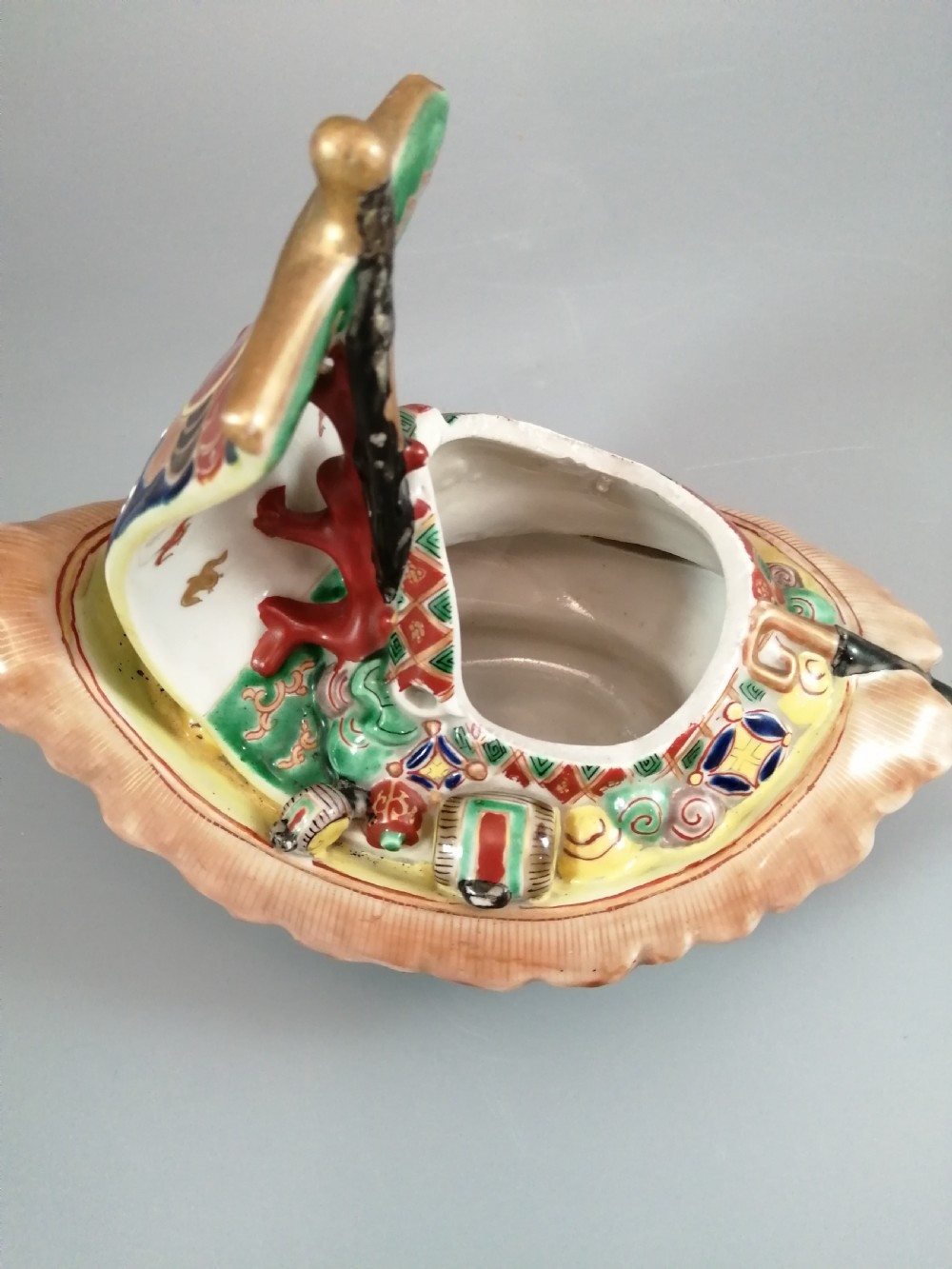 A Japanese Kutani porcelain censer shaped like a Takarabune treasure ship decorated with polychrome enamels and a wave-moulded base. View XIV