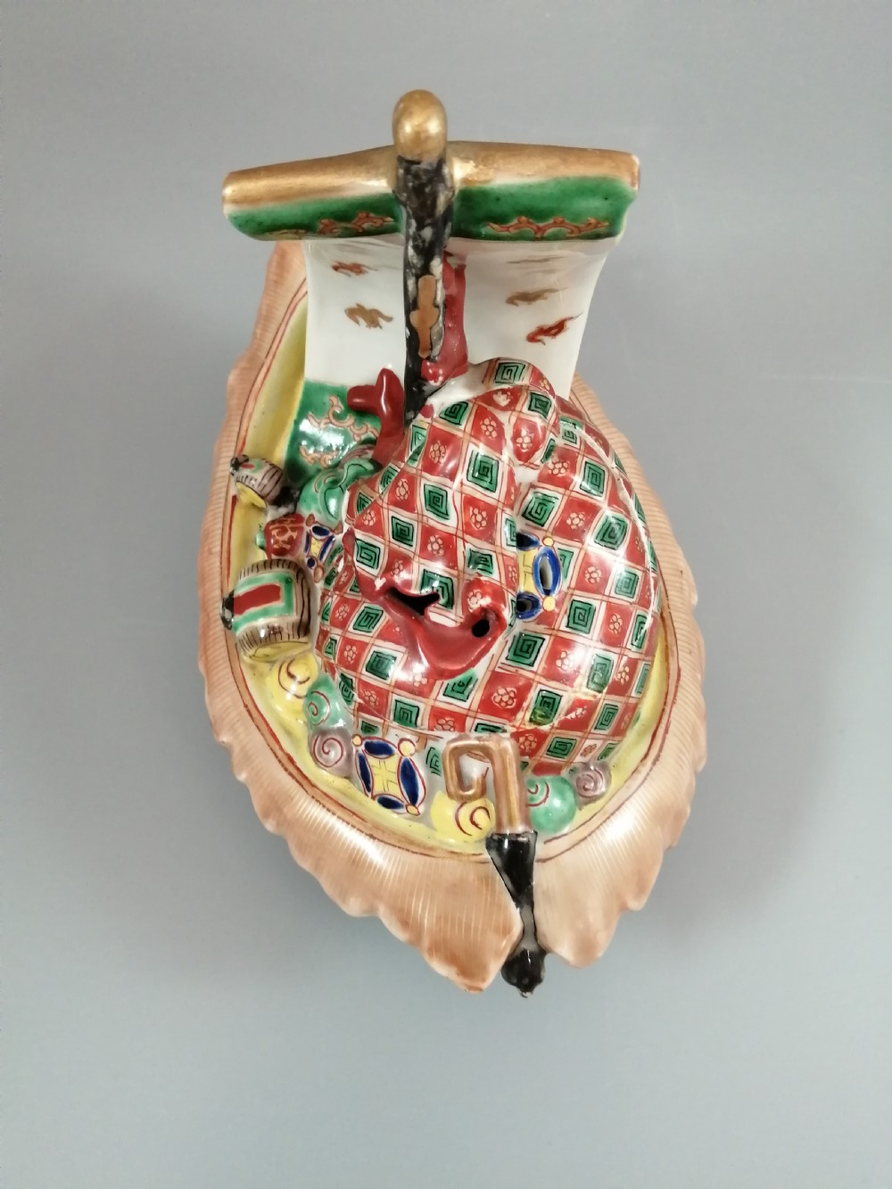 A Japanese Kutani porcelain censer shaped like a Takarabune treasure ship decorated with polychrome enamels and a wave-moulded base. View XV