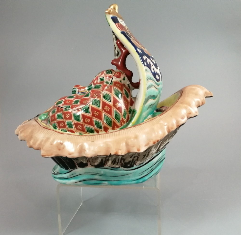 A Japanese Kutani porcelain censer shaped like a Takarabune treasure ship decorated with polychrome enamels and a wave-moulded base. View XX