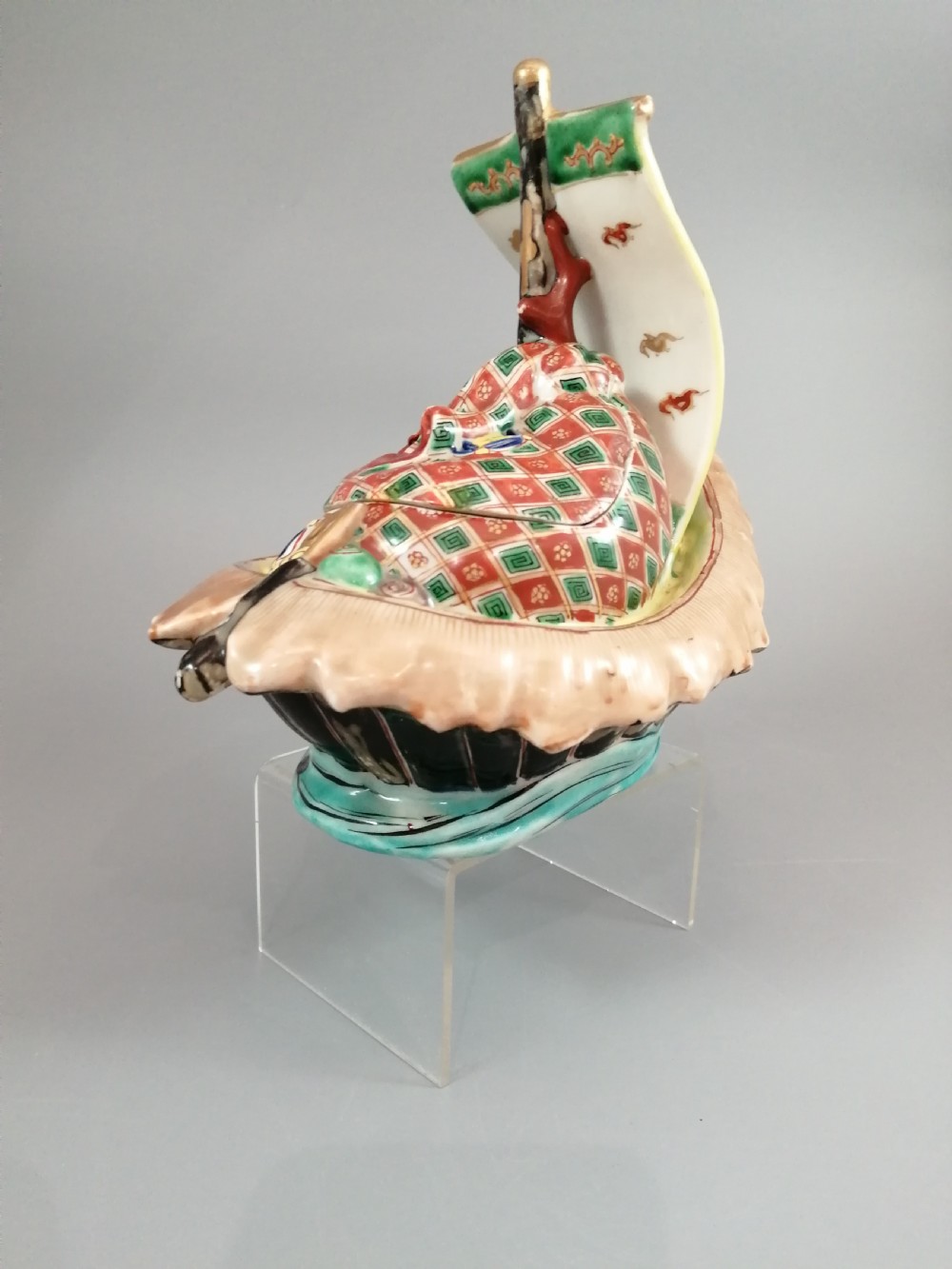 A Japanese Kutani porcelain censer shaped like a Takarabune treasure ship decorated with polychrome enamels and a wave-moulded base. View XXI