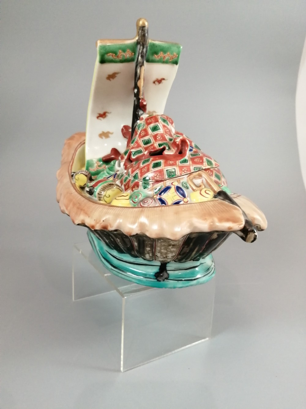 A Japanese Kutani porcelain censer shaped like a Takarabune treasure ship decorated with polychrome enamels and a wave-moulded base. View XXII