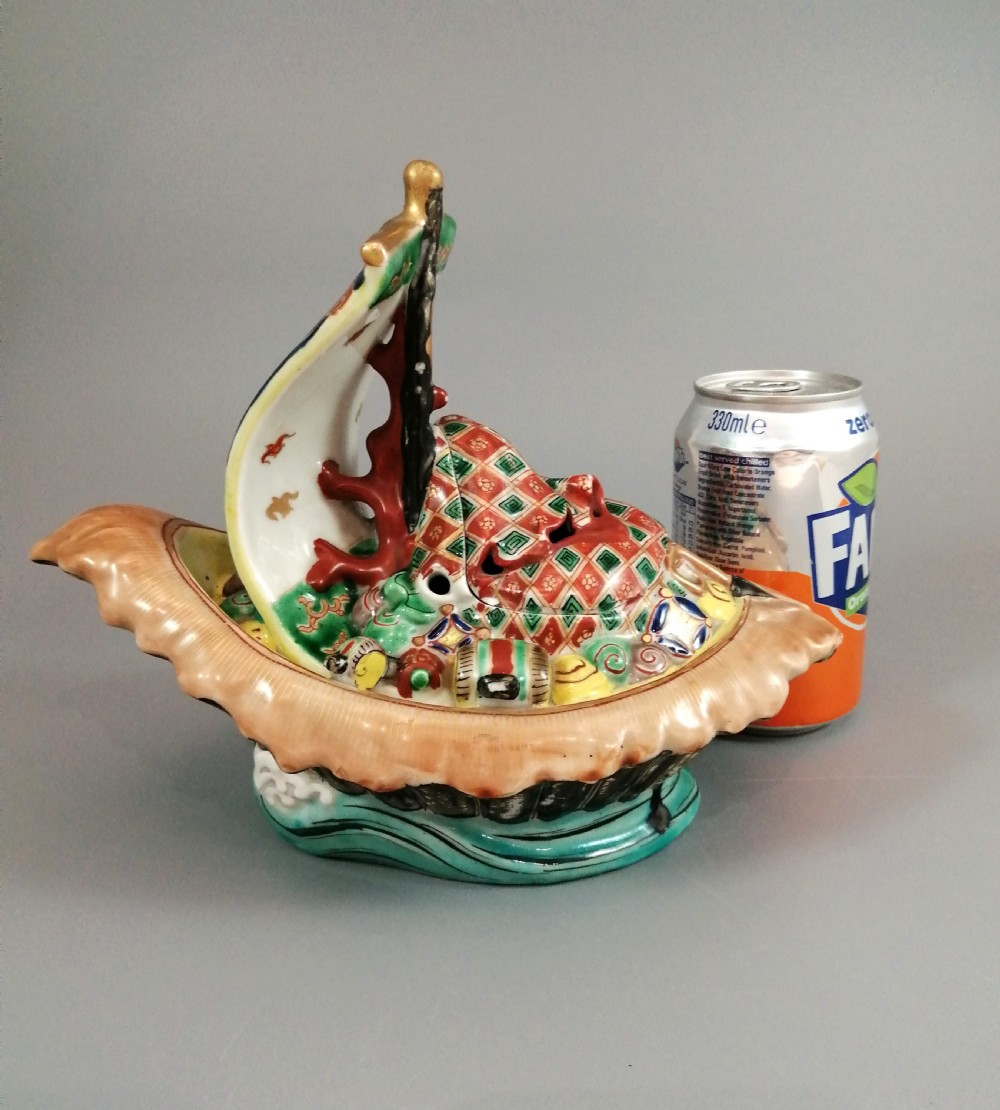 A Japanese Kutani porcelain censer shaped like a Takarabune treasure ship decorated with polychrome enamels and a wave-moulded base. View XXIV