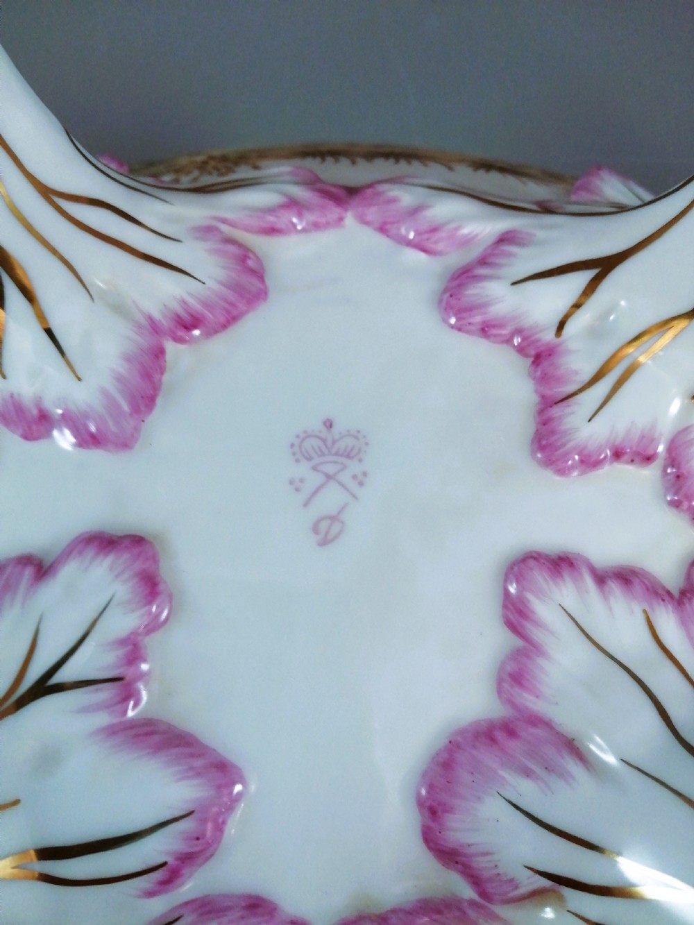 An antique continental porcelain soup tureen with a fruit finial lid, dual handles, and matching underplate, decorated with hand-painted birds and gilded scrollwork. View X