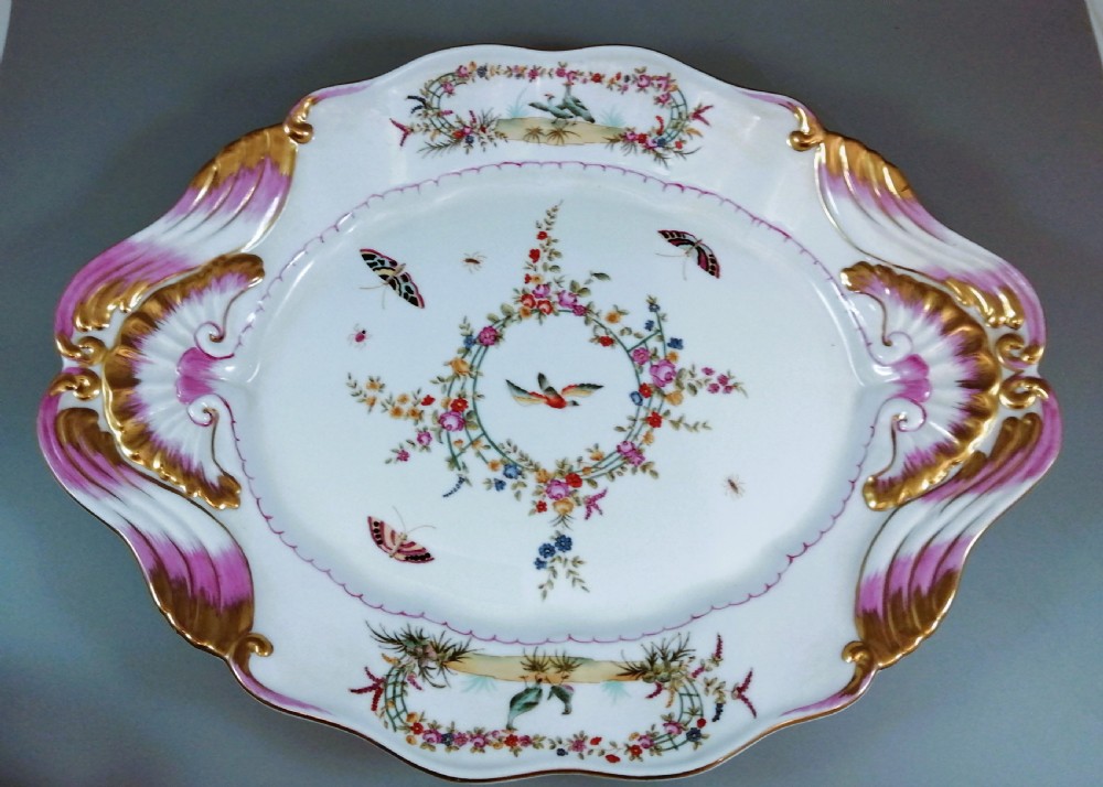 An antique continental porcelain soup tureen with a fruit finial lid, dual handles, and matching underplate, decorated with hand-painted birds and gilded scrollwork. View XIII
