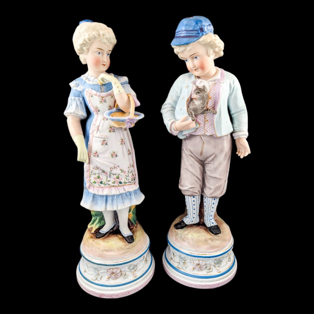 Pair of large antique 19th century French bisque porcelain figurines