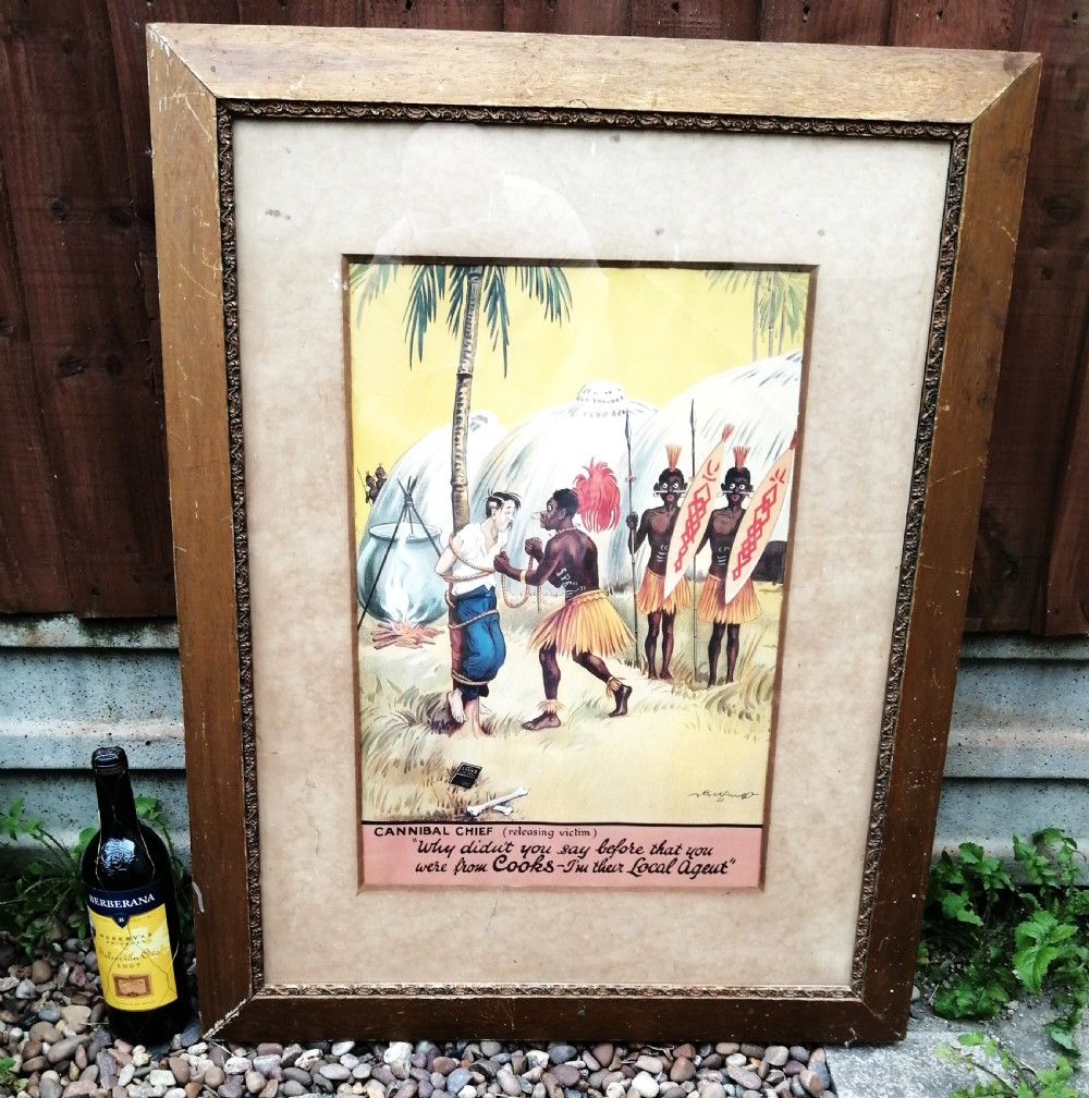 A framed 1930s colour travel agency cartoon advertisement illustrating a scene with a traveler tied to a tree near tropical huts and a cooking pot. View IV