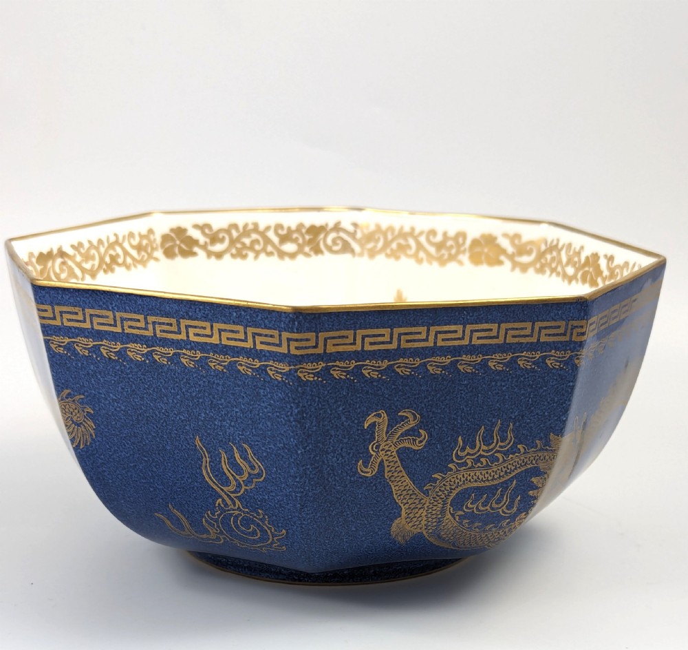 An octagonal cobalt blue ceramic bowl featuring gilded celestial dragon motifs and a Greek key upper rim. View VII