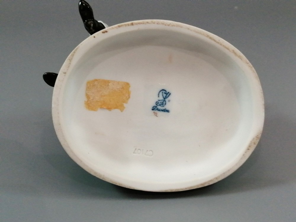 A Carl Thieme Potschappel hand-painted porcelain figurine depicting a young couple in eighteenth-century winter costume beside a sledge and brazier. View VIII