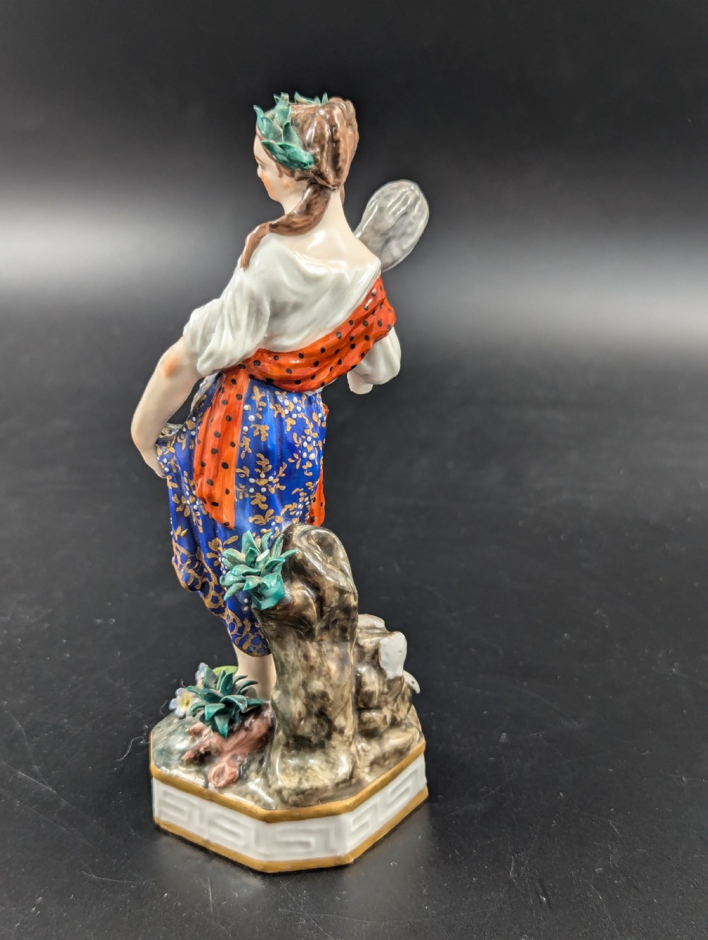 An antique hand-painted Derby porcelain figurine depicting an allegory of water on a moulded base. View III