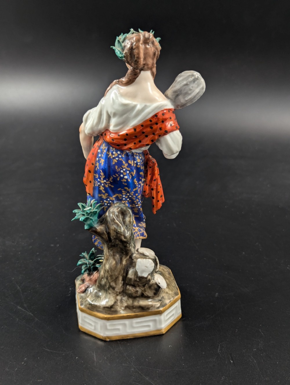 An antique hand-painted Derby porcelain figurine depicting an allegory of water on a moulded base. View IV