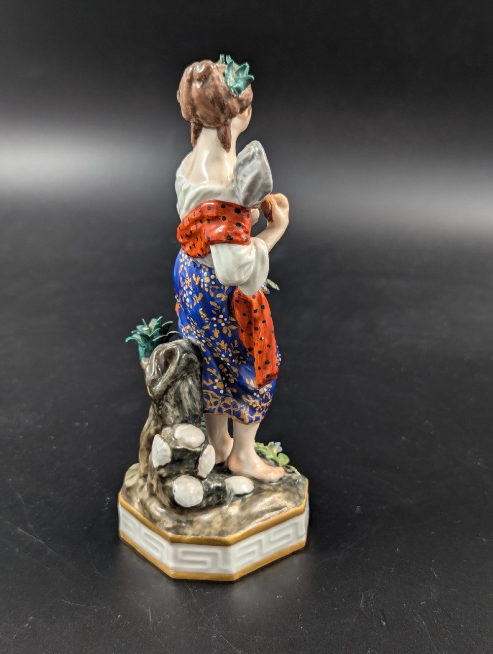 An antique hand-painted Derby porcelain figurine depicting an allegory of water on a moulded base. View V