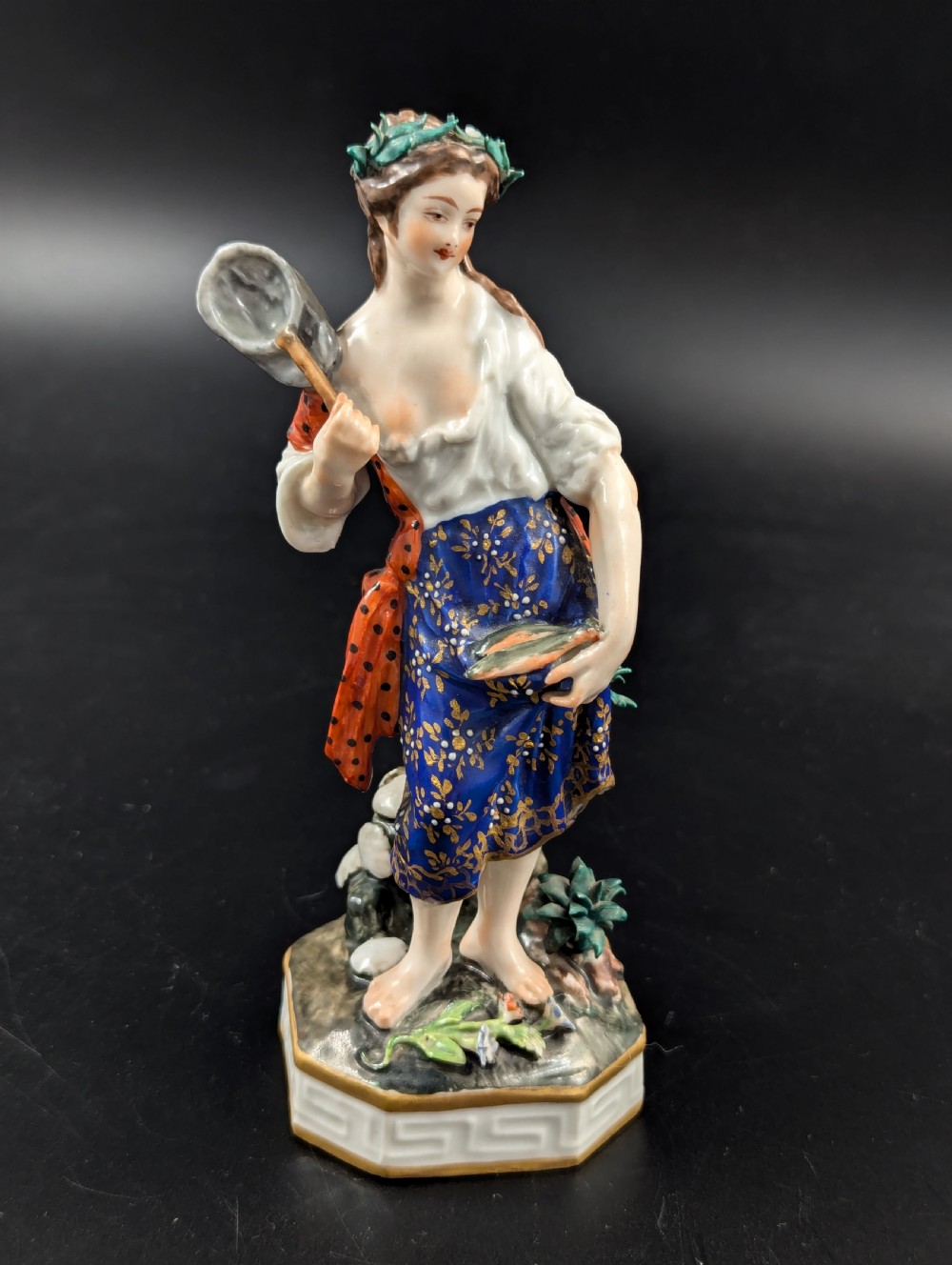 An antique hand-painted Derby porcelain figurine depicting an allegory of water on a moulded base. View VII