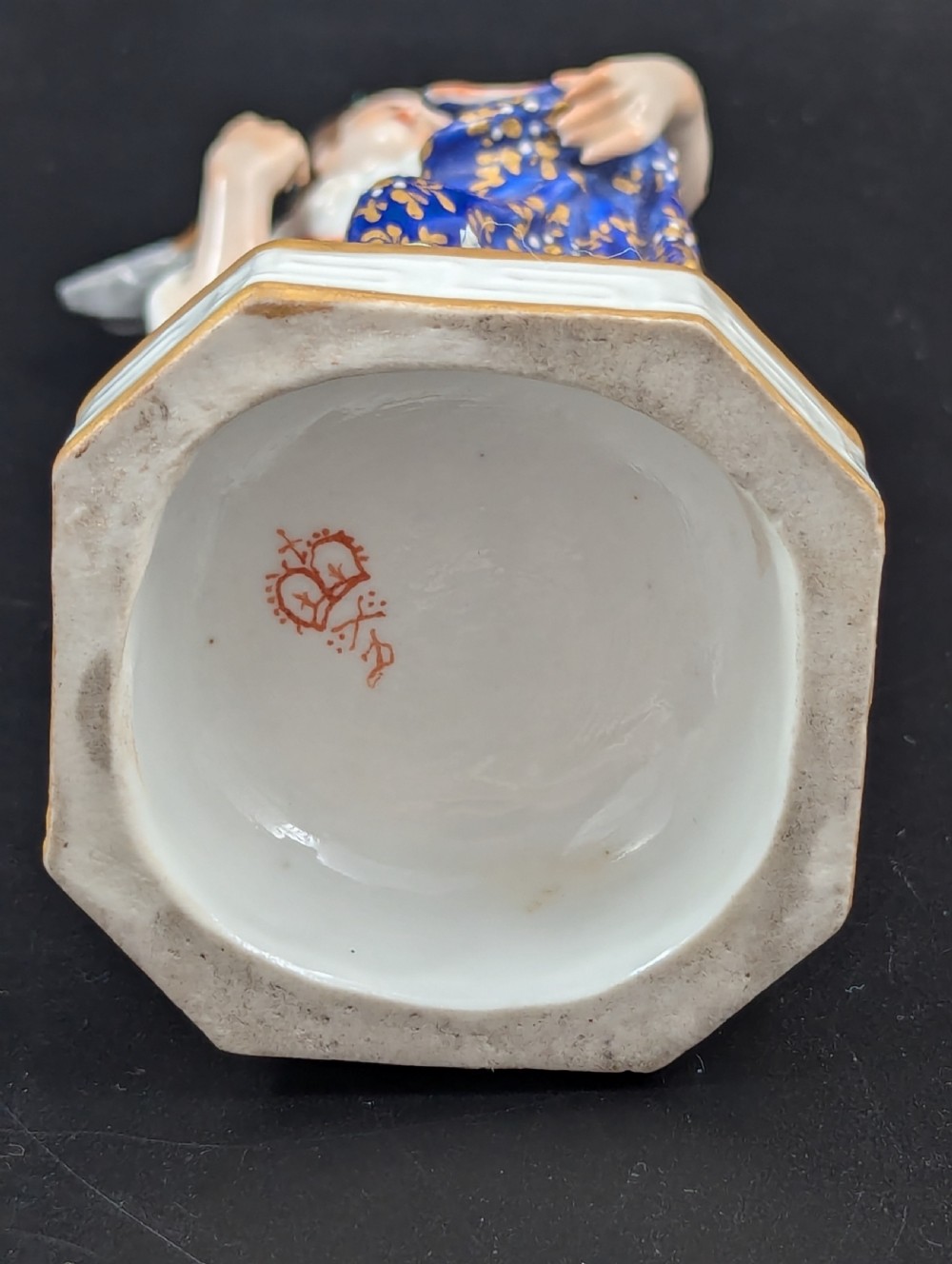 An antique hand-painted Derby porcelain figurine depicting an allegory of water on a moulded base. View IX