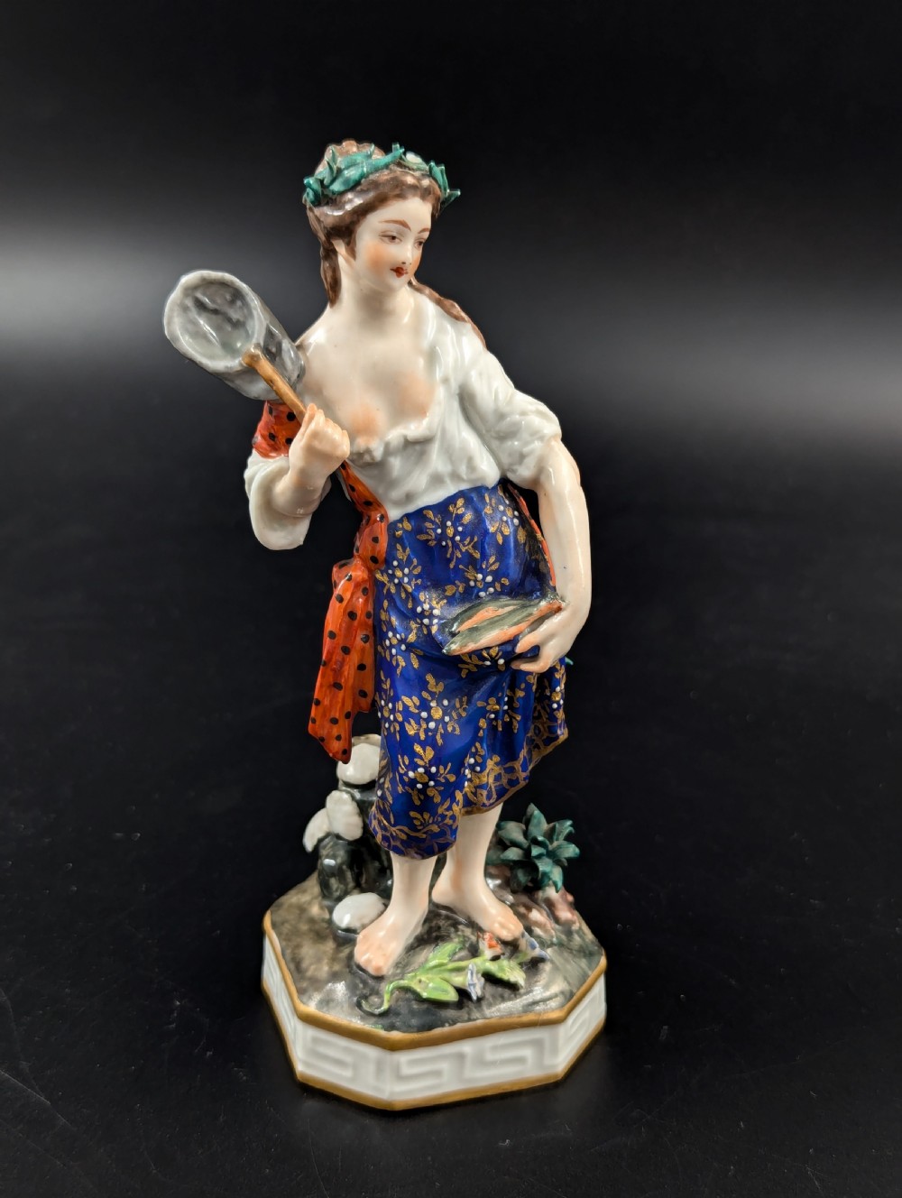 An antique hand-painted Derby porcelain figurine depicting an allegory of water on a moulded base. View X