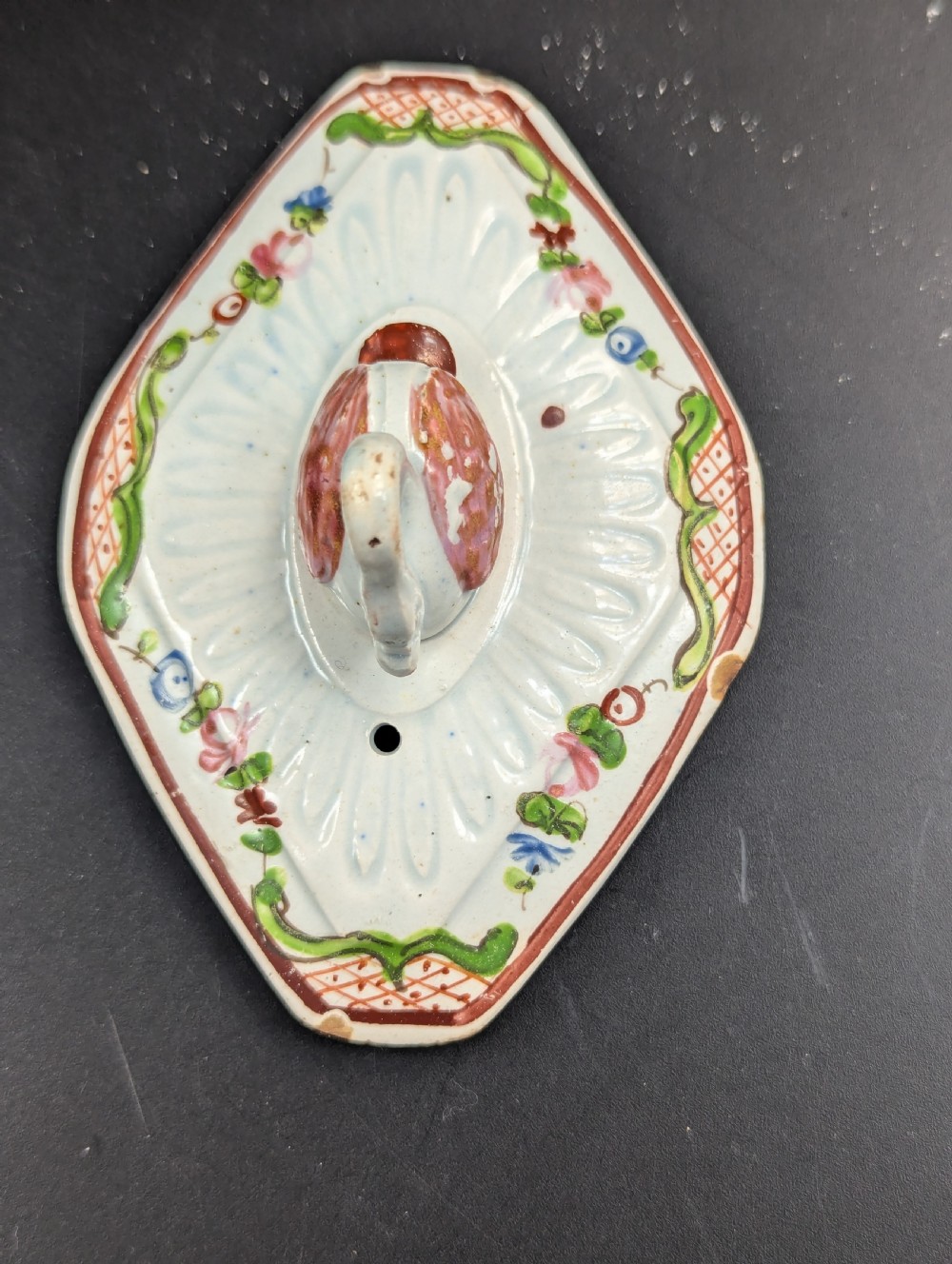 An octagonal off-white antique pearlware teapot decorated with hand-painted floral sprigs, a fluted base, and a swan-form lid knop. View VII