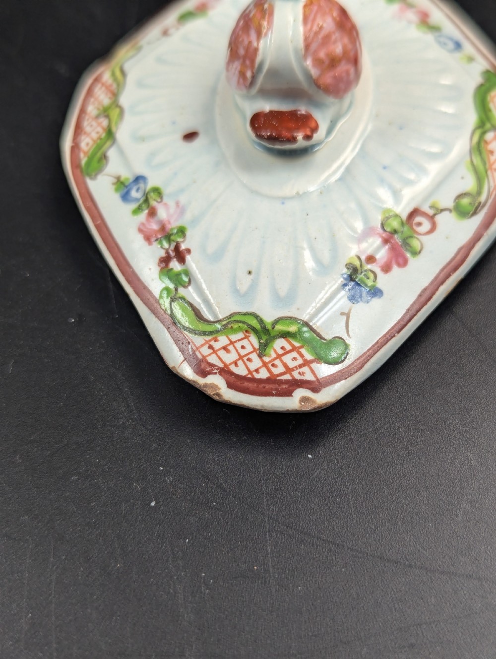 An octagonal off-white antique pearlware teapot decorated with hand-painted floral sprigs, a fluted base, and a swan-form lid knop. View VIII