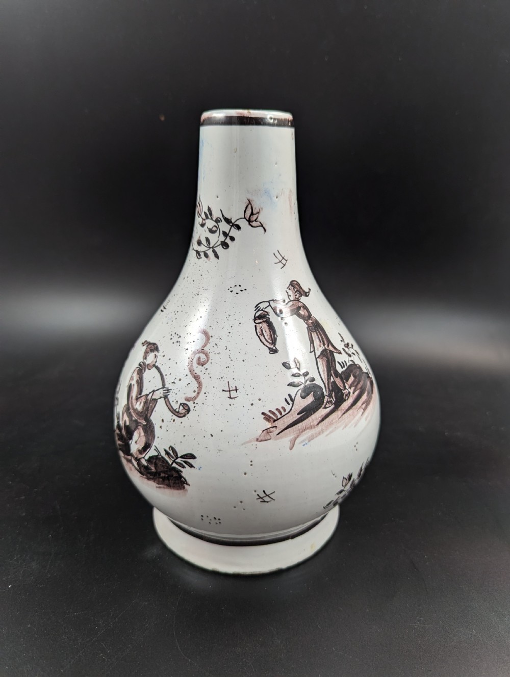 A mid-18th-century tin-glazed earthenware vase with a pear-shaped body, decorated with hand-painted manganese Chinoiserie figures. View II