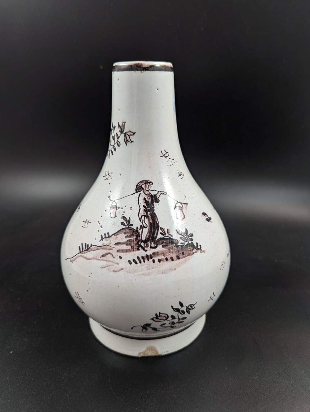 A mid-18th-century tin-glazed earthenware vase with a pear-shaped body, decorated with hand-painted manganese Chinoiserie figures. View VI