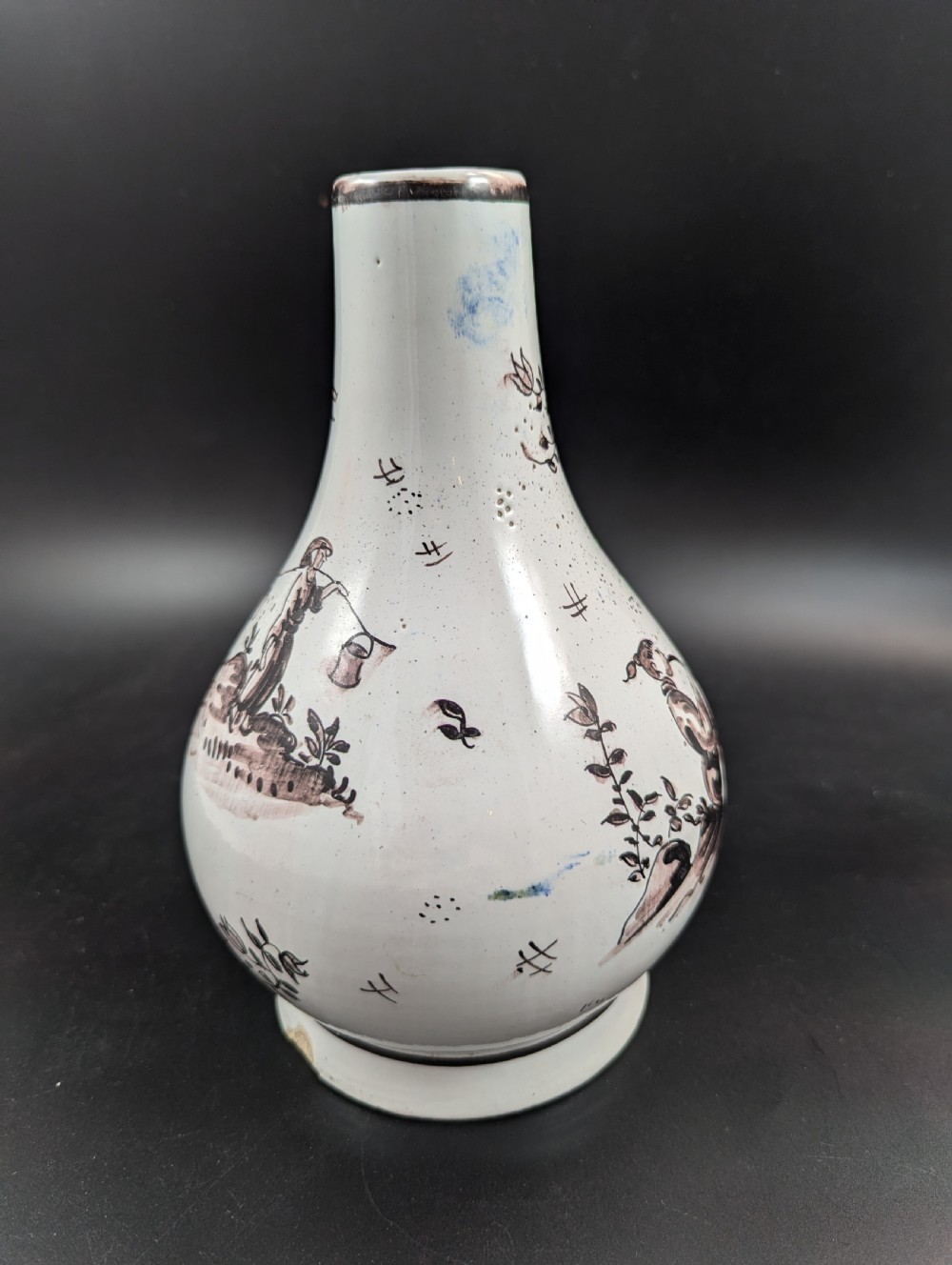 A mid-18th-century tin-glazed earthenware vase with a pear-shaped body, decorated with hand-painted manganese Chinoiserie figures. View VII