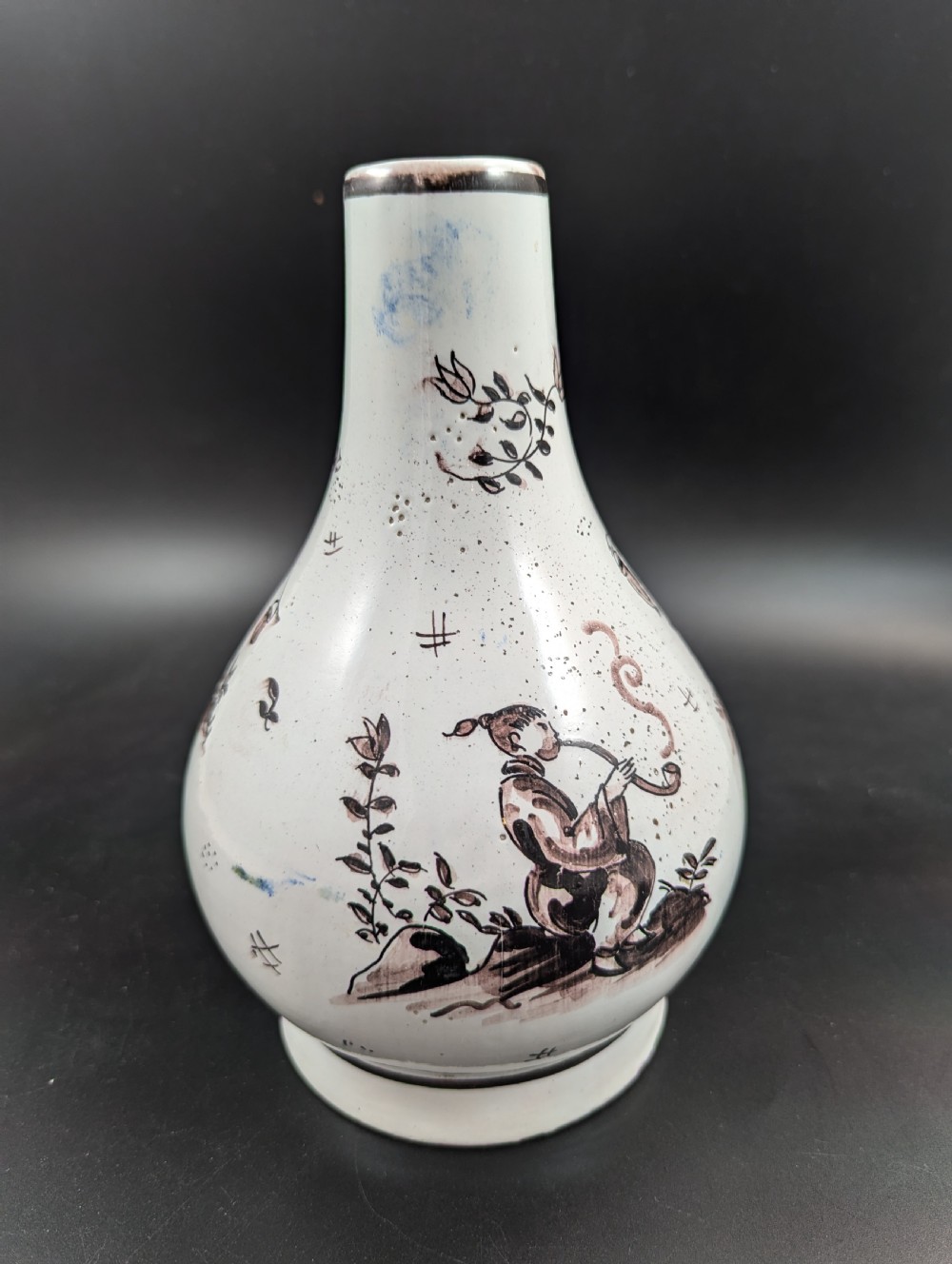 A mid-18th-century tin-glazed earthenware vase with a pear-shaped body, decorated with hand-painted manganese Chinoiserie figures. View VIII
