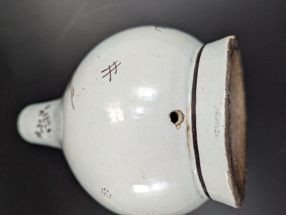 A mid-18th-century tin-glazed earthenware vase with a pear-shaped body, decorated with hand-painted manganese Chinoiserie figures. View XII