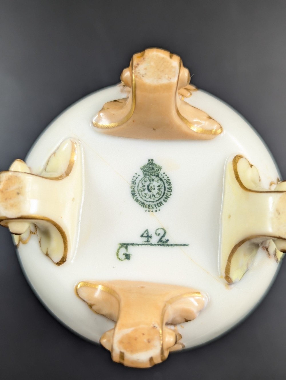A pair of Edwardian Royal Worcester porcelain vases featuring hand-painted pheasants in natural landscapes, with reticulated rims and gilt scroll feet. View VII