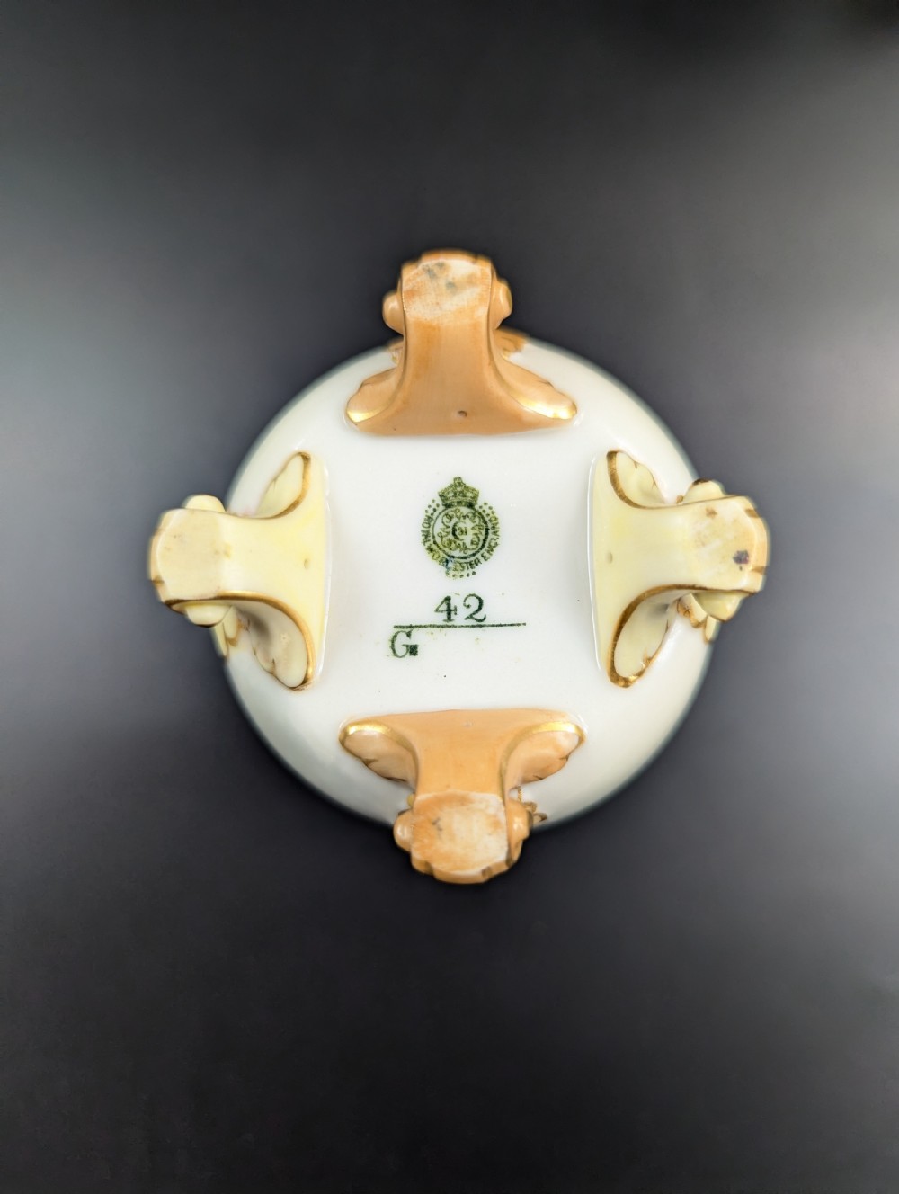 A pair of Edwardian Royal Worcester porcelain vases featuring hand-painted pheasants in natural landscapes, with reticulated rims and gilt scroll feet. View VIII