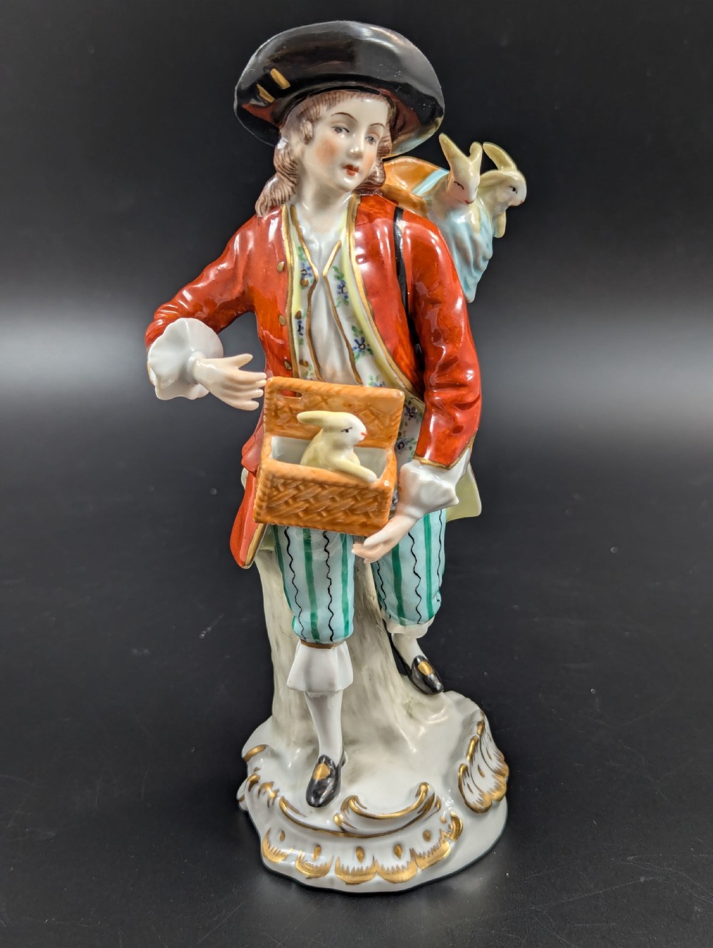 Lovely early 20th century Sitzendorf porcelain figurine of a young rabbit seller.