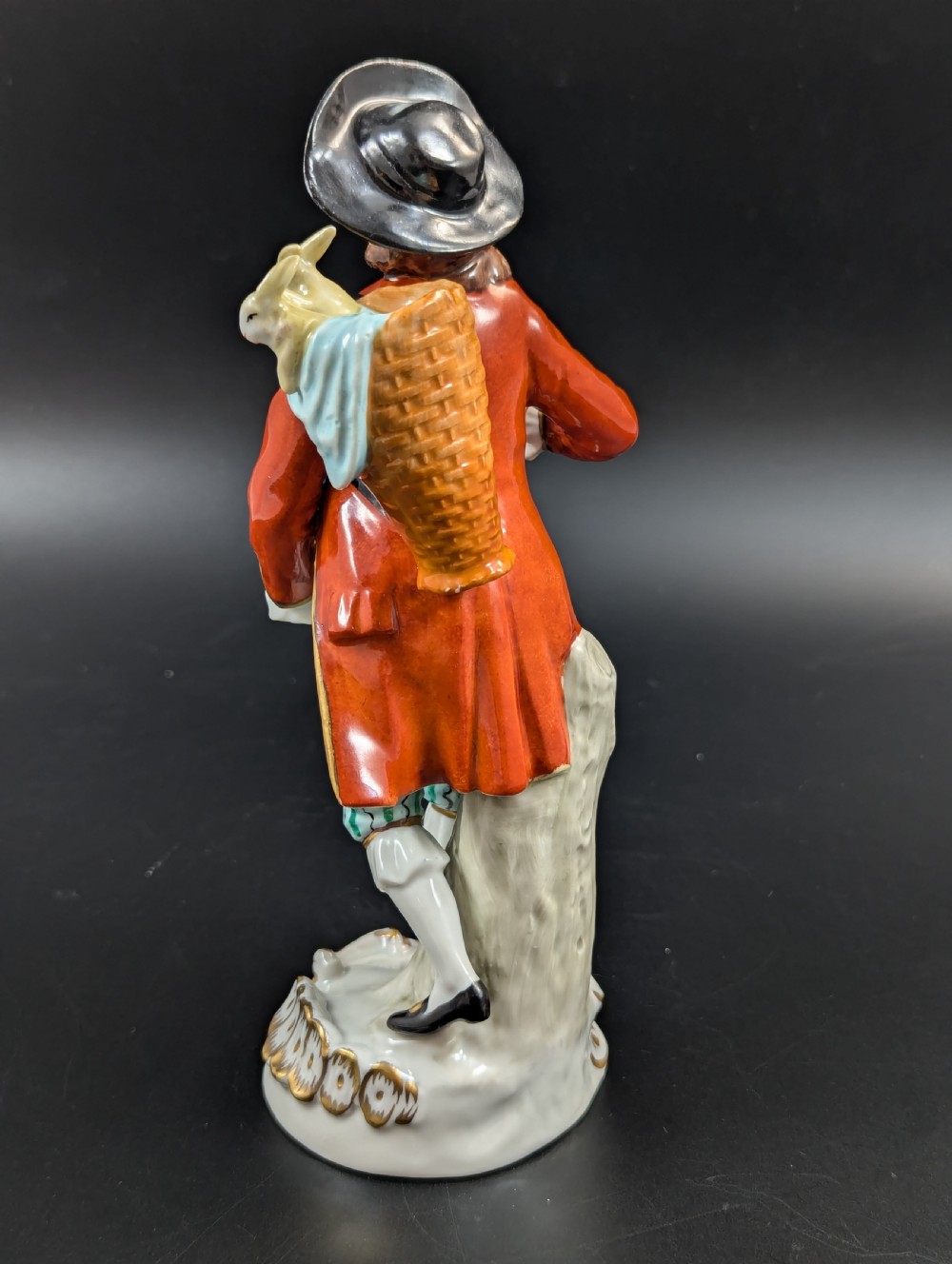 Lovely early 20th century Sitzendorf porcelain figurine of a young rabbit seller. View III