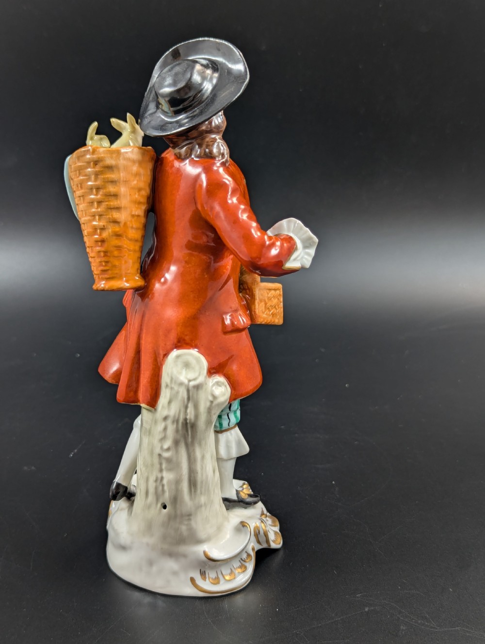 Lovely early 20th century Sitzendorf porcelain figurine of a young rabbit seller. View IV