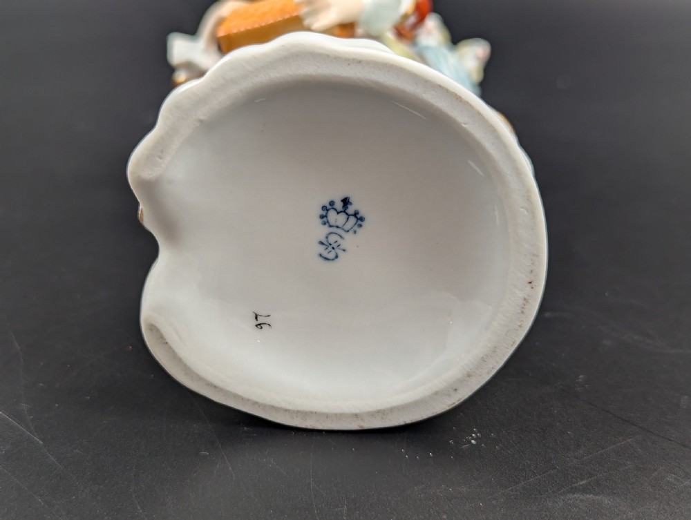 Lovely early 20th century Sitzendorf porcelain figurine of a young rabbit seller. View VI