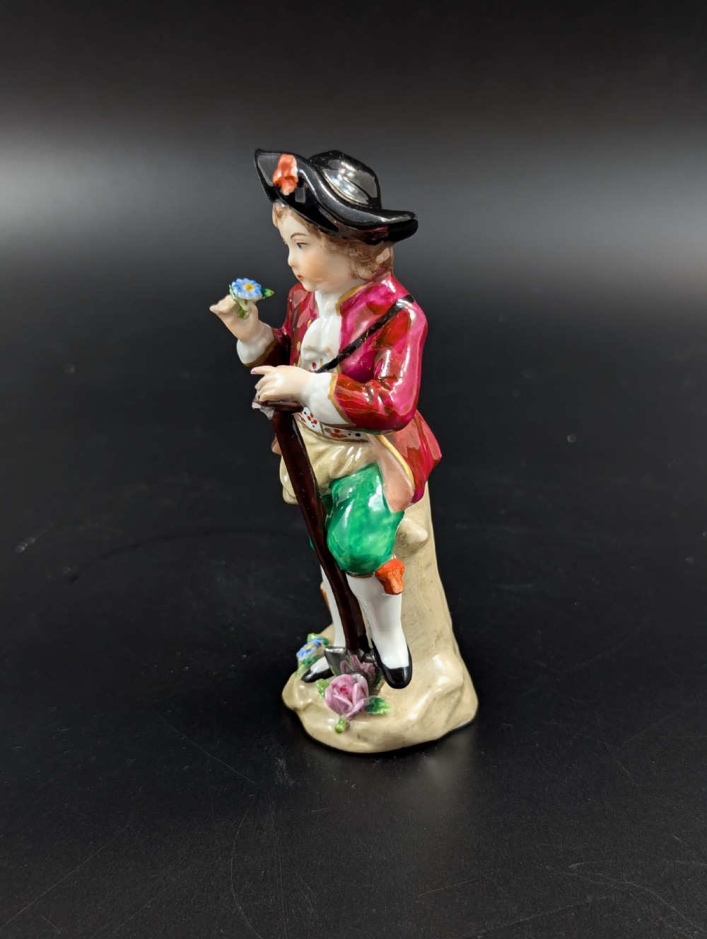 Lovely early 20th century Sitzendorf porcelain figurine of a young gardener. View II