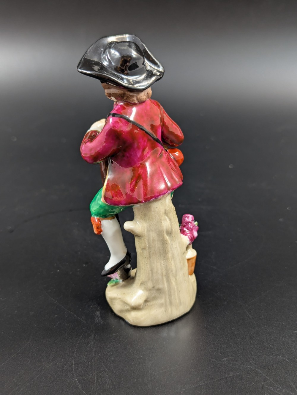 Lovely early 20th century Sitzendorf porcelain figurine of a young gardener. View III