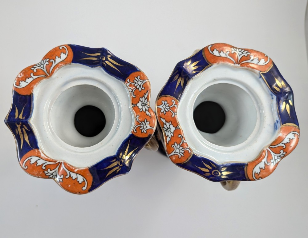 A pair of antique Masons ironstone vases decorated in a cobalt blue and terracotta Imari pattern with double gilt handles. View V
