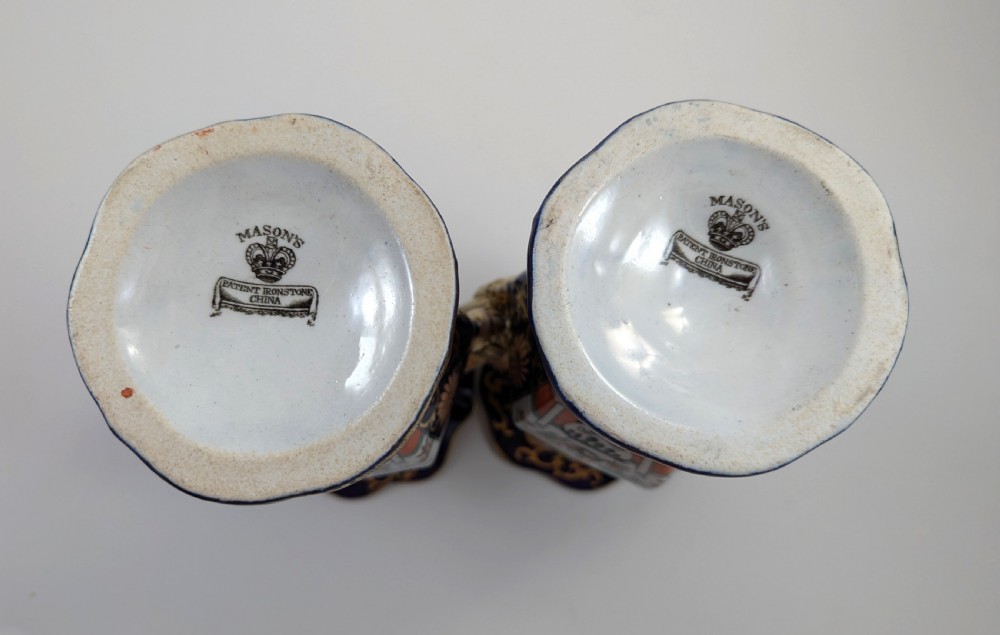 A pair of antique Masons ironstone vases decorated in a cobalt blue and terracotta Imari pattern with double gilt handles. View VI
