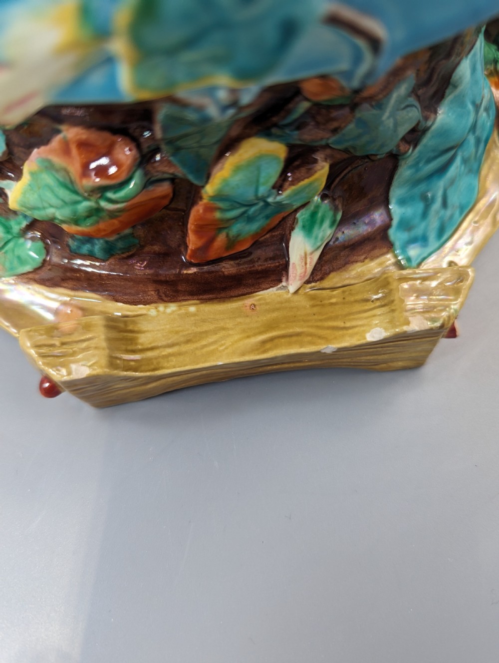A Victorian Royal Worcester turquoise majolica jardiniere planter featuring relief-moulded foliage and a faux-woodland base. View VII