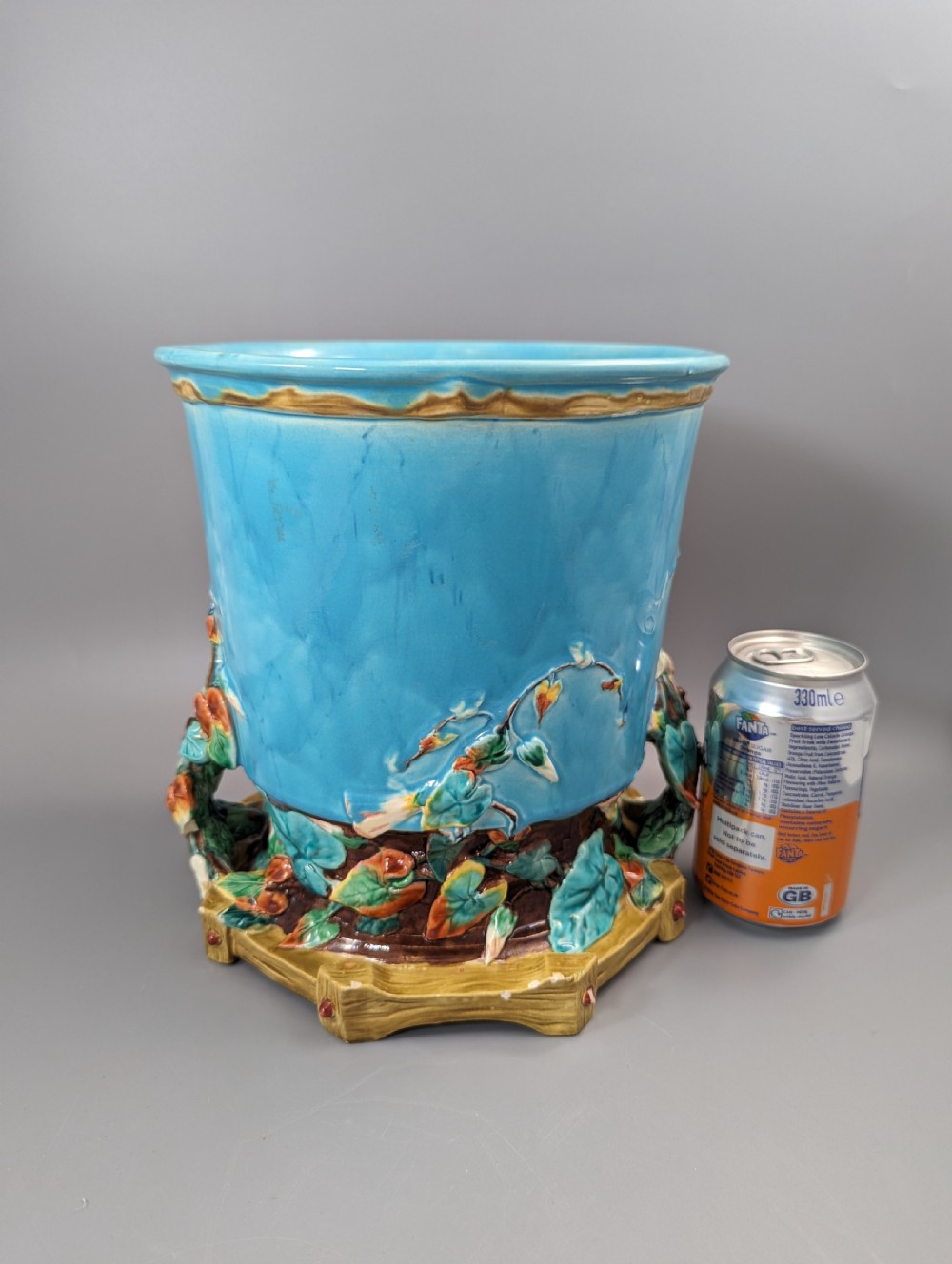 A Victorian Royal Worcester turquoise majolica jardiniere planter featuring relief-moulded foliage and a faux-woodland base. View XII
