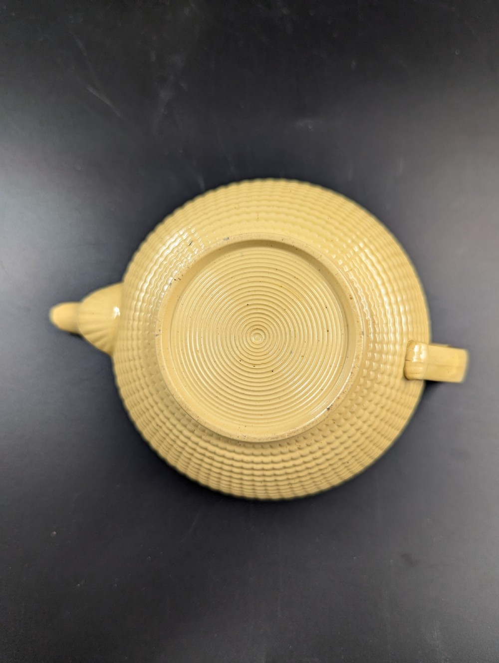 A Regency period buff stoneware teapot and matching creamer jug featuring engine-turned lattice patterning and applied white botanical reliefs. View IX