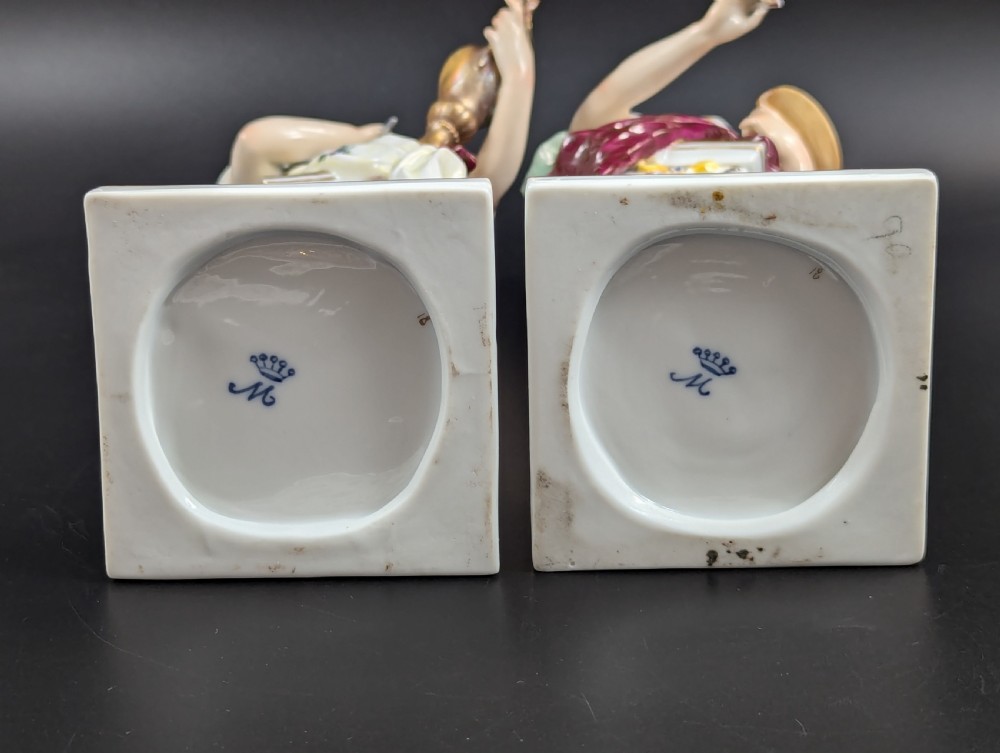 A set of four 19th-century glazed Italian porcelain figurines depicting allegorical female figures representing the arts atop gilded square pedestals. View VI