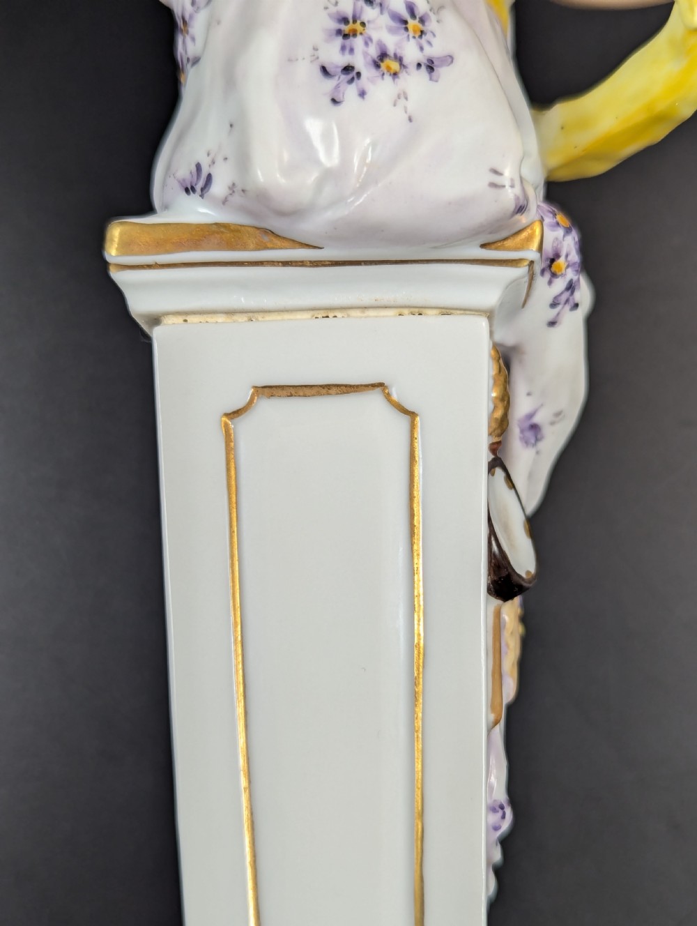 A set of four 19th-century glazed Italian porcelain figurines depicting allegorical female figures representing the arts atop gilded square pedestals. View VIII