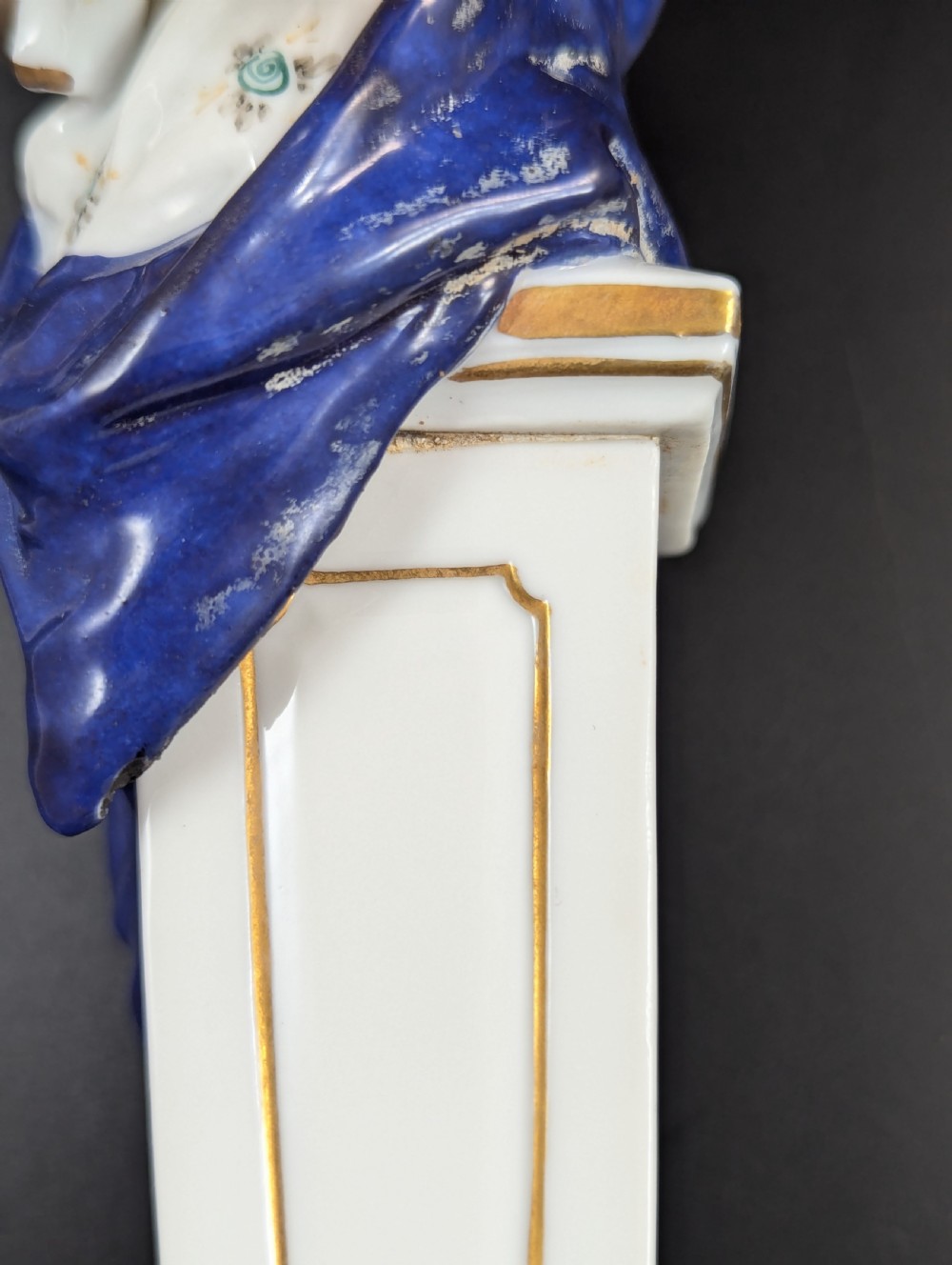 A set of four 19th-century glazed Italian porcelain figurines depicting allegorical female figures representing the arts atop gilded square pedestals. View IX