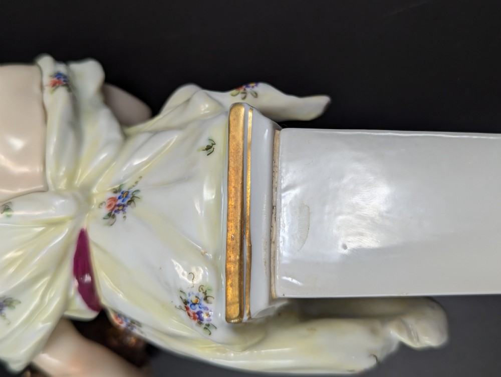 A set of four 19th-century glazed Italian porcelain figurines depicting allegorical female figures representing the arts atop gilded square pedestals. View X