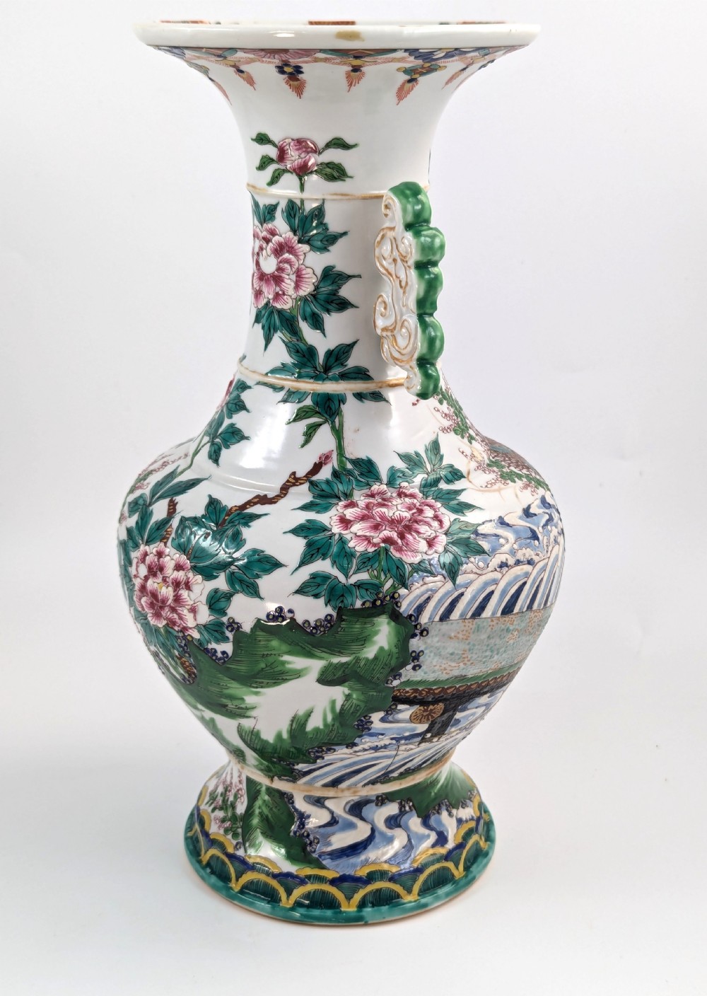 A 19th-century Japanese Kyoto Satsuma porcelain vase featuring scroll handles, a flared rim, and detailed polychrome enamel depictions of human figures and peony blossoms. View V