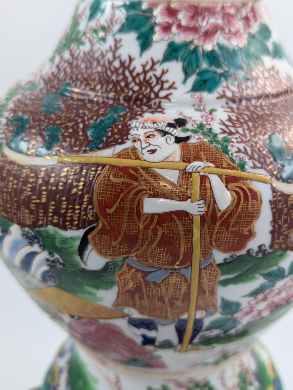 A 19th-century Japanese Kyoto Satsuma porcelain vase featuring scroll handles, a flared rim, and detailed polychrome enamel depictions of human figures and peony blossoms. View VIII
