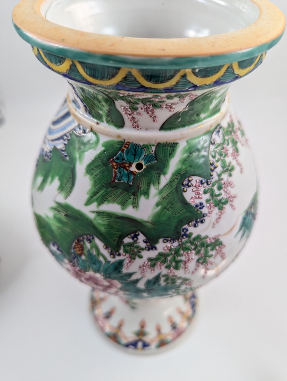 A 19th-century Japanese Kyoto Satsuma porcelain vase featuring scroll handles, a flared rim, and detailed polychrome enamel depictions of human figures and peony blossoms. View X